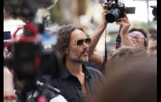 Actor--comedian Russell Brand arrives at Westminster Magistrates' court in London, Friday, May 2, 2025, to face charges of rape and sexual assault involving four women. (AP Photo/Alberto Pezzali)