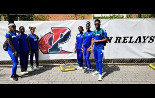 Coach Dino Rochester (right) and members of Meadowbrook High School’s track and field team at the 2026 Penn Relays in Philadelphia, United States.