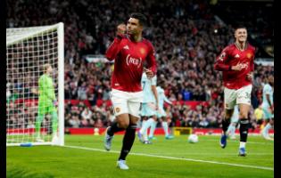 Manchester United’s Casemiro (left) celebrates after scoring, along with teammate Benjamin Sesko, during the English Premier League soccer match against Brentford in Manchester, England, on Monday.