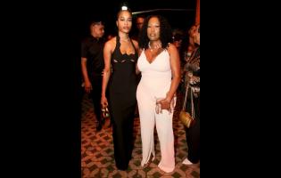 Roneika Melhado (left) and Juju Romillon share lens space at ONErpm celebration, held on Saturday at The Courtyard, Louise Bennett Garden Theatre, Hope Road, St Andrew.