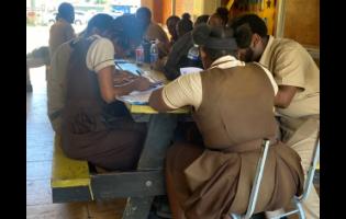 Students complete test papers at the Black River High School on Monday, April 20.