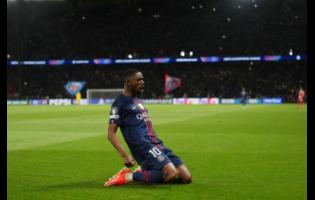 PSG’s Ousmane Dembele celebrates after scoring his side’s third goal during a Champions League semi-final, first leg match between Paris Saint-Germain and Bayern Munich in Paris, yesterday.