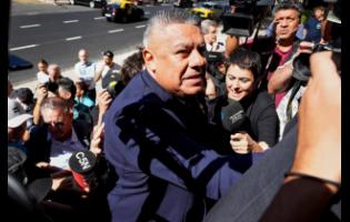 Claudio Tapia, president of the Argentine Soccer Association, arrives at court in connection with a complaint filed by Argentina’s tax collection agency on failure to pay social security taxes, in Buenos Aires, Argentina, on March 12.