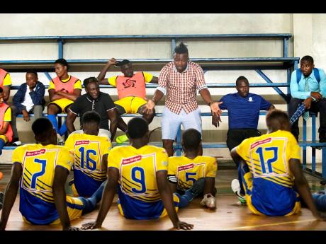 File
Harbour View FC head coach Fabian Taylor (standing) speaks with his team at half-time during their Red Stripe Premier League game with UWI Football Club at the UWI Mona Bowl in St Andrew on Wednesday, January 9, 2019. Harbour View won 1-0.