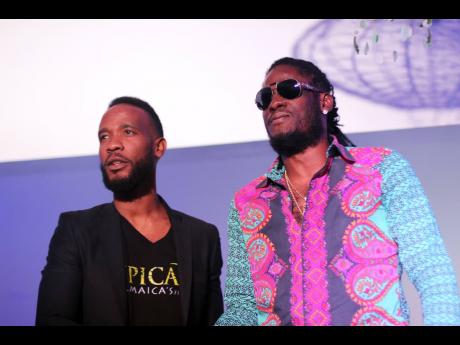 PHOTO BY STEPHANIE LYEW
Head of marketing at Epican Jermaine Bibbons (left) stands with dancehall entertainer Aidonia, the new ambassador for the cannabis brand.