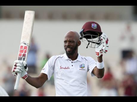 
West Indies’ Roston Chase celebrates after he scored a century against England during day four of the third cricket Test match at the Daren Sammy Cricket Ground in Gros Islet, St Lucia.