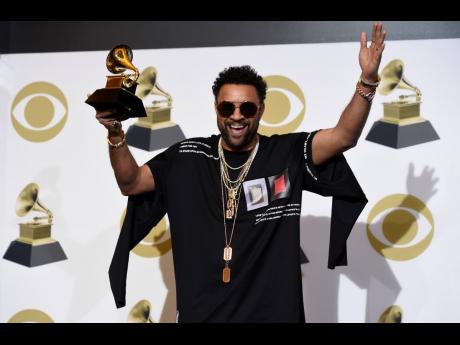 AP
Shaggy poses in the press room with the award for Best Reggae Album for ‘44/876’ at the 61st annual Grammy Awards at the Staples Center on February 10 in Los Angeles. 