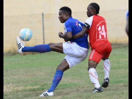 
In this file photo from Sunday, September 11, 2016, Stephen ‘One Left’ Williams (left), then of Portmore United, brings down the ball while being challenged by Andrew Peddlar of Maverley-Hughenden during a Red Stripe Premier League match at the Constant Spring field. Williams has since transferred to Waterhouse. 