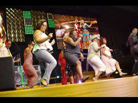 Anthony Minott/Freelance Photographer
Patrons at the Reggae Gold Awards do the Electric Slide during Marcia Griffiths&apos; performance last Wednesday. 