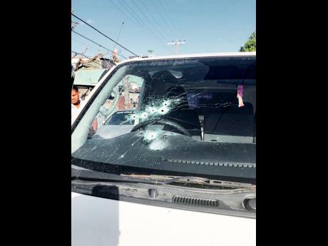 
The windscreen of the courier van was riddled with bullets as the driver and a security guard were cut down by robbers in Montego Bay on Sunday.
