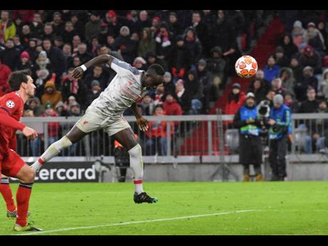 
Liverpool midfielder Sadio Mane (second left) scores his side’s third goal during the Champions League round-of-16 second leg match between Bayern Munich and Liverpool at the Allianz Arena, in Munich, Germany, yesterday. 
