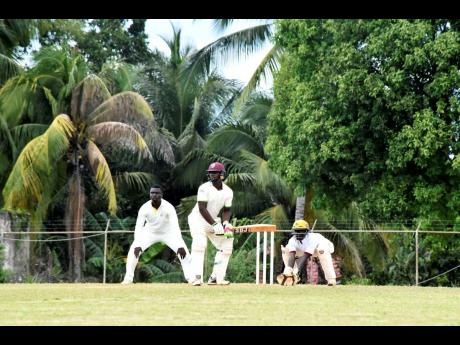  
Manchester High School’s batsman Oniel Roberts (centre) plays a shot in the semi-final of the ISSA/Grace Headley Cup at the STETHS Sports Complex on Wednesday.