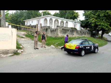 Police cordon off the crime scene in Rose Heights, St James. 