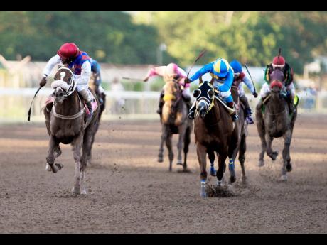 Robert Halladeen (left) wins last year’s Diamond Mile aboard Will In Charge.