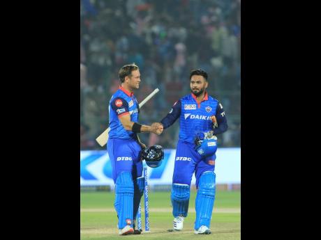 Delhi Capitals’ Rishabh Pant (right) shakes hands with Colin Ingram after winning the VIVO IPL T20 cricket match against Rajasthan Royals in Jaipur, India yesterday.