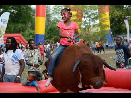 Seven-year-old Shaunakay Green is ready to ride the mechanical bull.