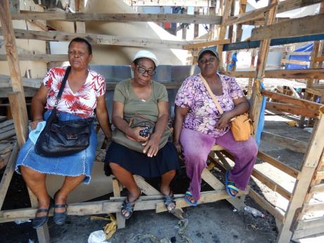 From left: Vendors Elaine Dixon, Advira Byfield and Donna Johnson ponder their next move.