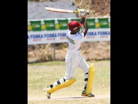Leronne Tyrell of Rio United plays one of many impeccable shots on his way to a century against St Margaret’s Bay in the SDC Community T20 cricket competition in Buff Bay, Portland, yesterday.