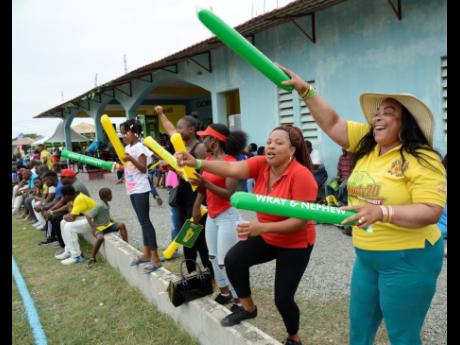 Credit: Ian Allen Johnson Mountain supporters in a jubilant mood after their team won the Social Development Corporation (SDC) T/20 Cricket tournament at Goodyear Oval in St Thomas yesterday.