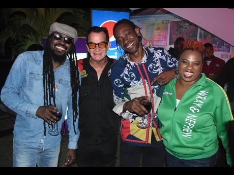Legendary dancehall artistes Beenie Man (left) and Bountry Killer (second right) hang out with Joe Bagdonovich (second left), chief organiser of Reggae Sumfest, Nadia Kiffin-Green, marketing manager, J. Wray and Nephew Limited, at Downsound headquarters on Belmont Road, Kingston, on Wednesday, May 29.