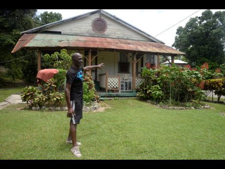 Michael ‘Fox’ Hutchinson says the railway house behind him has been occupied by his family for five decades. 