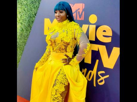 Dancehall queen Spice reigns in yellow at the MTV Movie and TV Awards. 