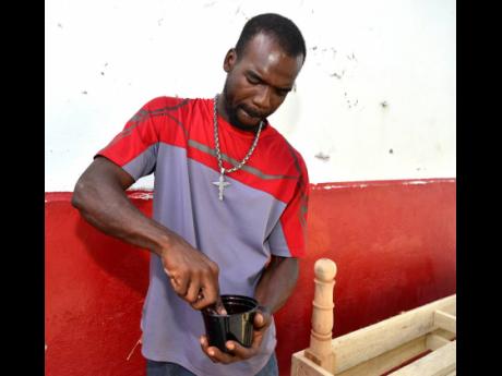 Bryce gets ready to varnish the bed.