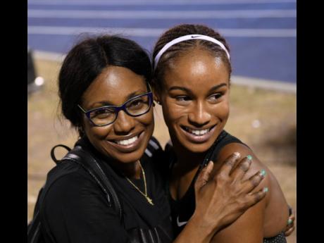 Briana Williams strikes a pose with her mother Sharon Simpson after the 17-year-old finished third in the women’s 100m at the National Senior Championships last Friday to qualify for the World Championships later this year.