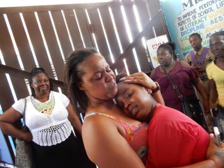 Joycelin Bassier is overcome with joy as she hugs daughter Shannelle.