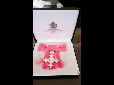 Credit: conntributed The MBE that was presented to Joan Wilson.