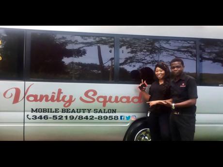The Vanity Sqaud team members: Kenroy Davis (right) and Sasha Dunkley pose in front of the unit. 