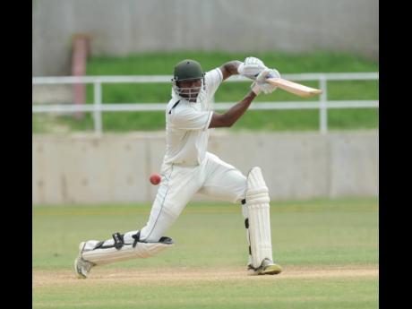 In this file photo from Monday, December 8, 2014, David Bernard Jr plays a shot for four runs against the Leeward Islands Hurricanes on the final day of the Cricket West Indies Professional Cricket League Regional 4-Day Tournament at Sabina Park in Kingston.