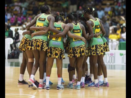 Members of Jamaica’s national senior women’s netball team, the Sunshine Girls, huddle during a match against England in the Sunshine Series at the National Indoor Sports Centre on Saturday, October 13, 2018. 