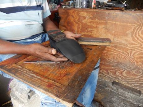 Credit: Roshea Masters A new sole being attached to a shoe that has already racked up some miles.