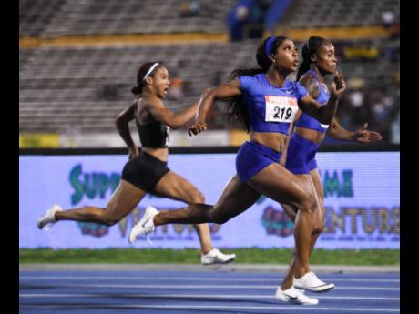 Shelly-Ann Fraser-Pryce at the women’s 100m at the recently concluded National Senior Championships as 17-year-old Briana Williams chases.