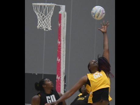 Credit: Collin Reid Photos courtesy of Collin Reid, Courts Jamaica, Jamaica Tourist Board, Alliance Investments, Dairy Industries, and Supreme Ventures.
National goal attack Romelda Aiken (left) jumps for a high ball during the Sunshine Girls’ training session on Wednesday, ahead of today’s Netball World Cup game against Fiji in Liverpool, England.