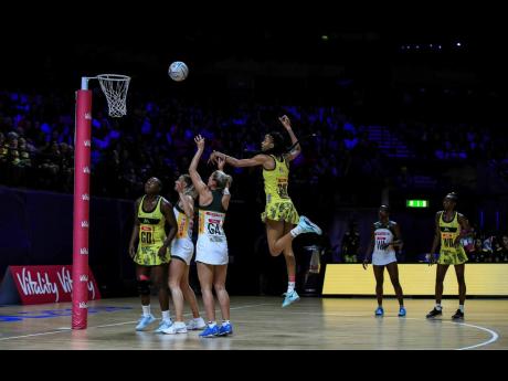 Credit: Peter Byrne South Africa’s Phumza Maweni shoots at the net against Jamaica during the Netball World Cup match in Liverpool yesterday.