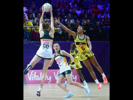 Credit: Collin Reid Jamaica’s Adean Thomas challenges for the ball as South Africa’s Karla Pretorius (GD) tries to pass it to her teammate, Erin Burger (C).