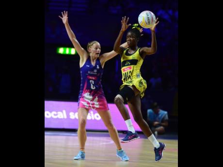 Jamaica’s Nicole Dixon (right) gets aerial ahead of Scotland’s Claire Maxwell.