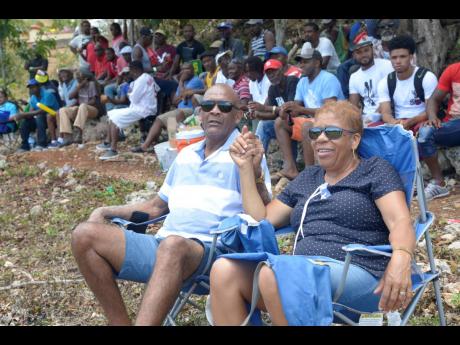 Cricket fans Junior and Monica Enjoy the gentleman’s game at the Three Hills Oval in St Mary where Junction’s Ballards Valley from St Elizabeth face Gayle from St Mary in the quarter-final of the SDC Wray & Nephew national T20 cricket competition.