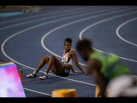 refuses to leave the track moments after she was adjudged to have false started in the 100m hurdles final at the JAAA/Supreme Ventures Limited National Senior Athletics Championships at the National Stadium on Sunday, June 23. File