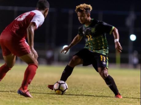 Gladstone Taylor
Kyle Butler (right) in action for Jamaica’s U-23 men’s football team against St Kitts and Nevis in 2020 Olympic Games qualifying at the Anthony Spaulding Sports Complex on Sunday night.