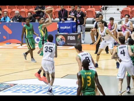Jamaica’s Joshua Minott (second left) takes a shot during their opening game against Mexico in the FIBA Under 17 CentroBasket Championships in San Juan, Puerto Rico yesterday. 