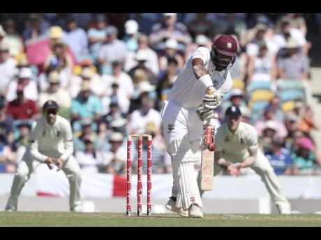 Windies opener John Campbell, of Jamaica, plays a straight drive off the bowling of England pacer James Anderson during day one of the first Test at Kensington Oval in Bridgetown, Barbados, on Wednesday, January 23. Campbell made 44. 