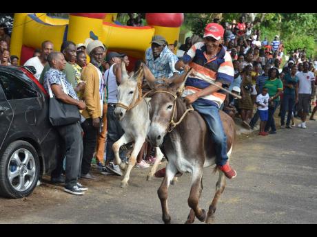 Veteran jockeys Roy Richards (right), aboard Ceasefire, and John Dawkins (left), aboard  Blazeaway, took the youngsters to school yesterday. They won several races.