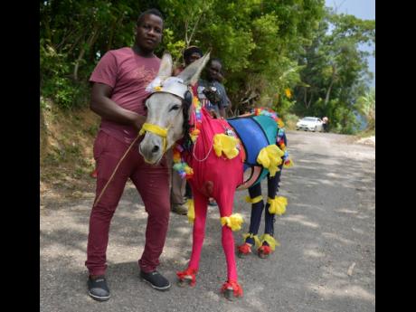 Dwayne Jones poses with his donkey, Pablo, which was adjudged the best dress donkey at the races.