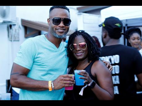 Barbados Tourism Marketing’s Corey Garrett and Alison Alleyne join in on the cocktail fun at Medz last Saturday, August 2.