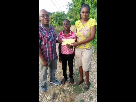 Credit: . NCB’s Laurie Spencer (left) meet Merrick Foster and his mother, Ann-Marie Williams.