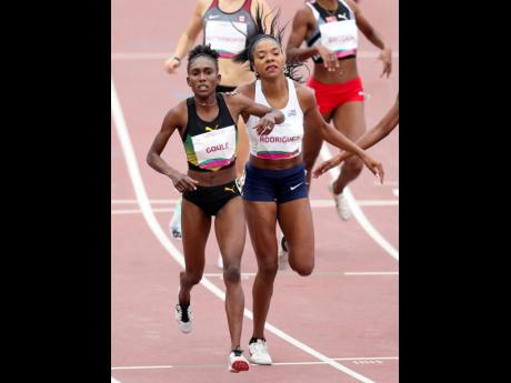 Natoya Goule of Jamaica (left), and Deborah Rodriguez of Uruguay finish first and third, respectively, in the women’s 800m final at the Pan American Games in Lima, Peru, yesterday.