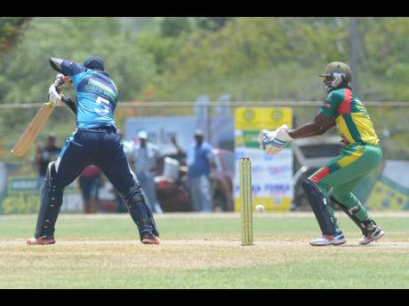 Johnson Mountain’s Jair Campbell plays a shot in semi-final one of the SDC/Wray & Nephew National T20 Community Cricket competition at the Ultimate Cricket Ground yesterday.